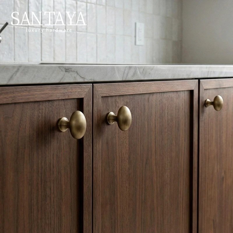 Antique brushed brass single-hole cabinet knob gallery image 3