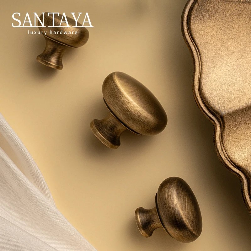 Antique brushed brass single-hole cabinet knob gallery image 2