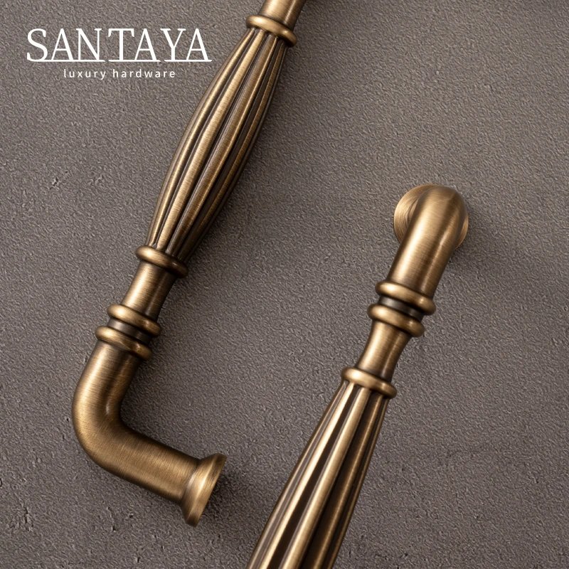 Close view of fluted antique brass drawer pull handles